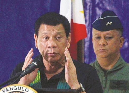 President Rodrigo Duterte speaks before soldiers during a visit at a military camp in Awang, Maguindanao in southern Philippines yesterday.