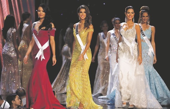 Miss Universe candidates parade in their evening gowns during a preliminary competition in Pasay, Metro Manila.