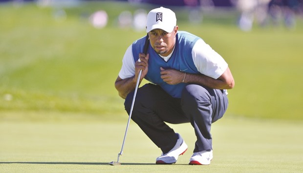 Tiger Woods lines up a putt on the 1st green during the first round of the Farmers Insurance Open at Torrey Pines Municipal Golf Course in La Jolla, California, on Thursday. (USA TODAY Sports)