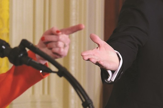 Britainu2019s Prime Minister Theresa May gestures during a joint press conference with US President Donald Trump in the East Room of the White House yesterday in Washington, DC.