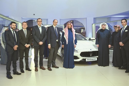 Hussain Alfardan, chairman of Alfardan Group, Omar Alfardan, president and CEO of Alfardan Group, and other officials pose with the new Maserati Quattroporte.