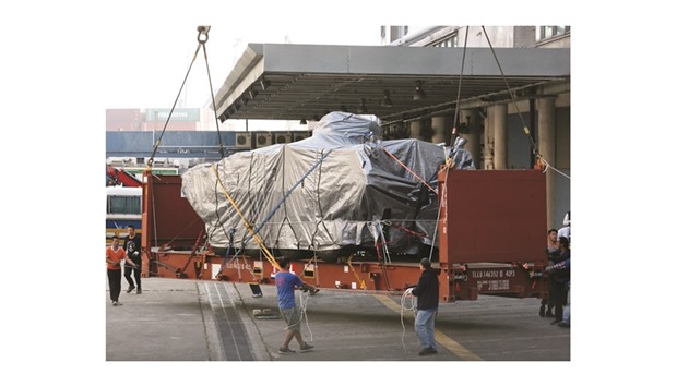One of nine Terrex armoured vehicles, which belong to Singapore, waits to be loaded onto a truck at a cargo terminal in Hong Kong on Friday morning.