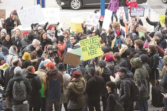 Protesters gather at JFK International Airportu2019s Terminal 4 to demonstrate against President Donald Trumpu2019s executive order, yesterday in New York.