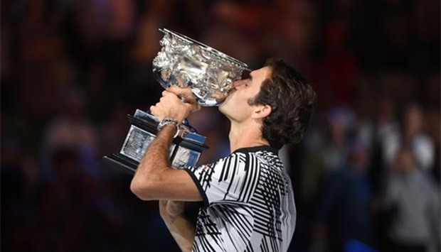 Roger Federer holds the championship trophy after defeating Rafael Nadal at the Australian Open in Melbourne on Sunday.