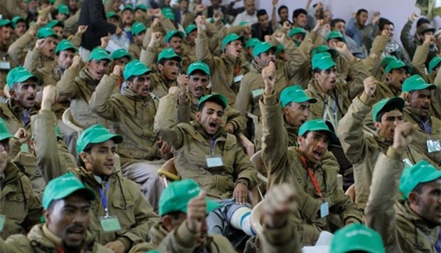 Pro-Houthi fighters, who have been injured during recent fighting, shout slogans during a rally in Sanaa on Sunday.