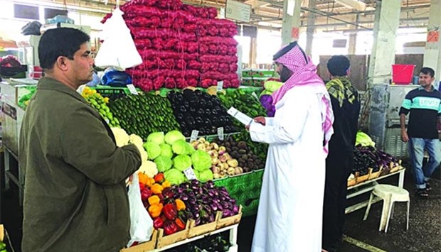 A vegetable shop at Central Market is being inspected.