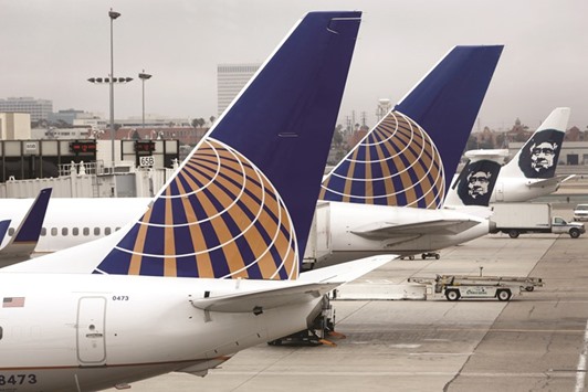 United Continental Airlines airplanes wait at the gate at Los Angeles International Airport. United CEO Oscar Munoz is trying to win back passengers at key airports as part of a broader renewal effort, which includes plans to cut costs and catch up with Deltau2019s industry-leading profits.