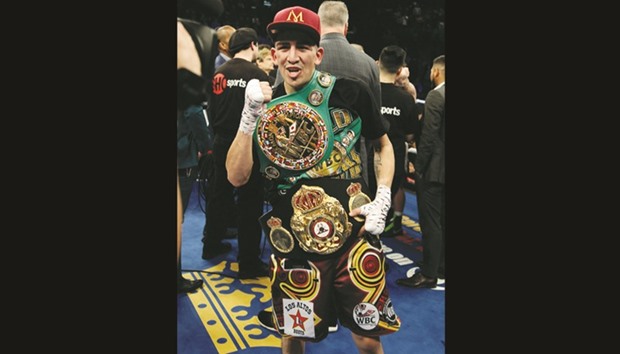 Leo Santa Cruz celebrates his majority decision win over Carl Frampton after their WBA featherweight title fight in Las Vegas. (AFP)