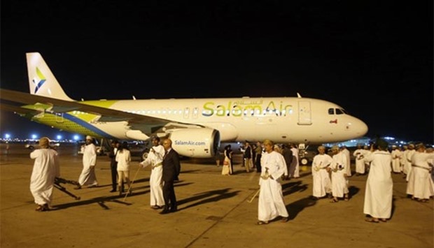 Omanis take photos on the tarmac during the unveiling of SalamAir at the Muscat International Airport on Sunday.