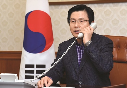 South Koreau2019s acting president, Hwang Kyo-ahn, speaks on the phone to US President Donald Trump in Seoul.