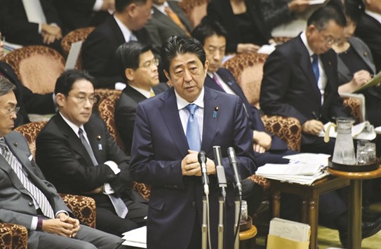 Japanu2019s Prime Minister Shinzo Abe (centre) answers questions during a budget committee session of the House of Councillors at the Diet in Tokyo yesterday. Abe will meet US President Donald Trump for face-to-face talks on February 10, a local news agency reported.
