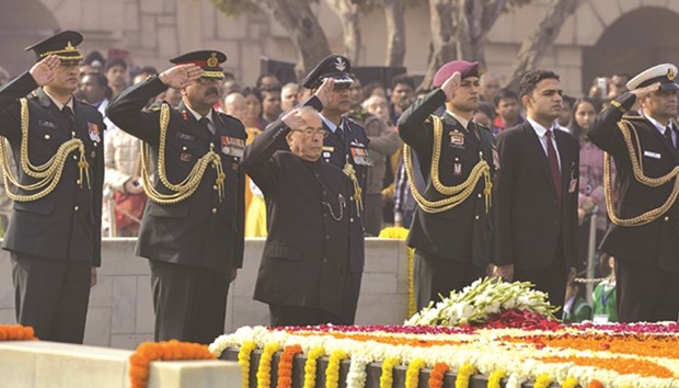 President Pranab Mukherjee pays tribute to Mahatma Gandhi on his 69th death anniversary at the Rajghat in New Delhi, yesterday.