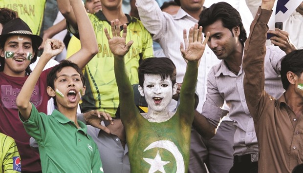 File picture of a Pakistani spectator watching the first ODI between Pakistan and Zimbabwe at the Gaddafi Cricket Stadium in Lahore.