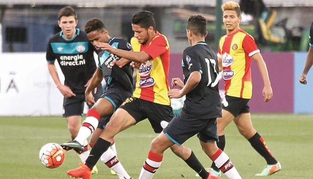 Action from the match between PSV Eindhoven (in blue) and Esperance De Tunis (in red and yellow) yesterday.