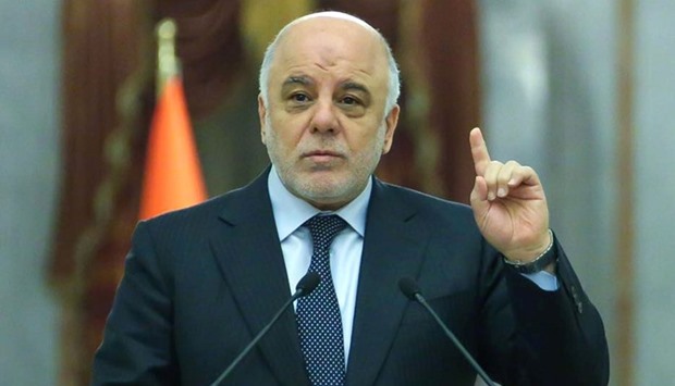Iraqi Prime Minister Haidar al-Abadi (C) speaking during an official meeting in the capital Baghdad.