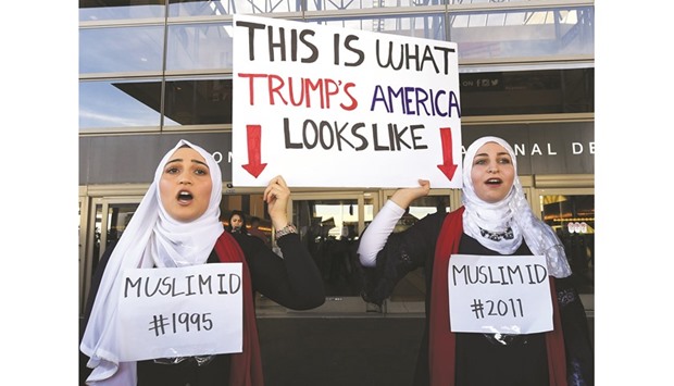 Noor Hindi (left) and Sham Najjar, who were born in the US of Syrian parents, demonstrate against the immigration ban imposed by President Trump at the Los Angeles International Airport.
