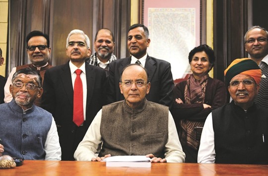 Union Finance Minister, Arun Jaitley and his team pose in his office a day before presenting the Union Budget 2017-2018, in New Delhi yesterday.