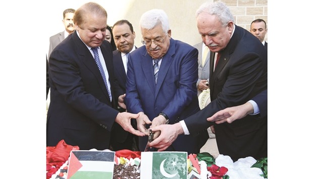 Palestinian president Mahmoud Abbas and Pakistanu2019s Prime Minister Nawaz Sharif cut a ribbon at the opening of the Palestinian embassy in Islamabad yesterday.