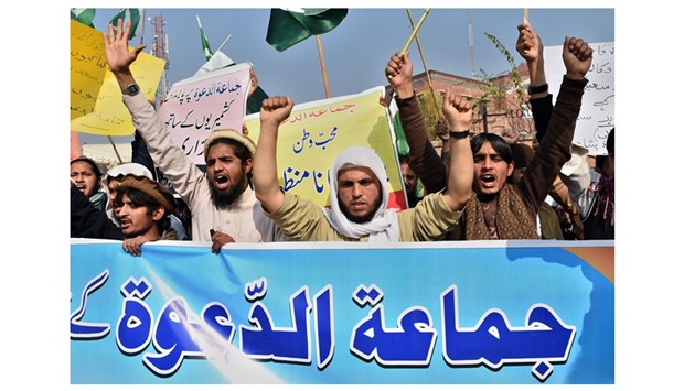 Supporters of the Jamaat-ud-Dawa (JuD) organisation shout slogans during a protest after JuD leader Hafiz Saeed was placed under house arrest by authorities in Peshawar yesterday.
