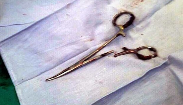 A pair of scissors, which was removed from a patient's abdomen after being left behind during a surgery 18 years ago, is seen at a clinic in the northern Vietnamese city of Thai Nguyen.