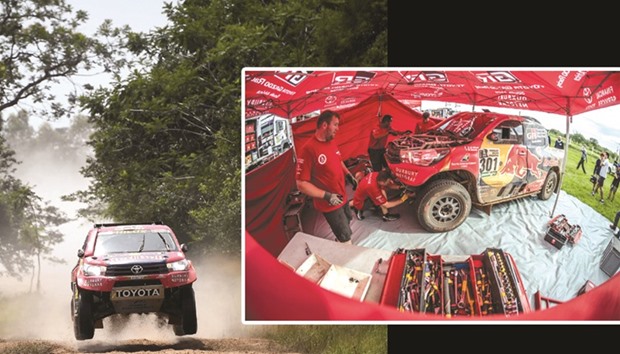 Qatar's Nasser al-Attiyah in action. (Right) His Toyota Hiluxe at the service after yesterday's second stage.