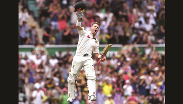 Australiau2019s batsman David Warner celebrates reaching his century against Pakistan on the first day of the third Test match at the SCG in Sydney yesterday.