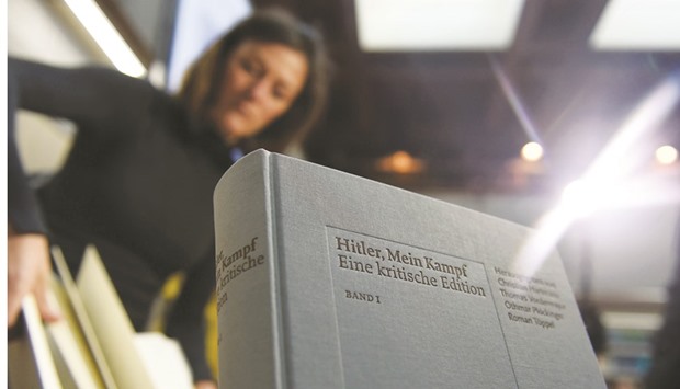 This file photo taken on January 8, 2016 shows a copy of an annotated version of Mein Kampf. The first reprint the book in Germany since World War II has proved a surprise bestseller, heading for its sixth print run, its publisher said yesterday.