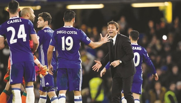 Chelseau2019s Diego Costa and manager Antonio Conte celebrate after their win over Stoke City at Stamford Bridge in London on Saturday. (Reuters)