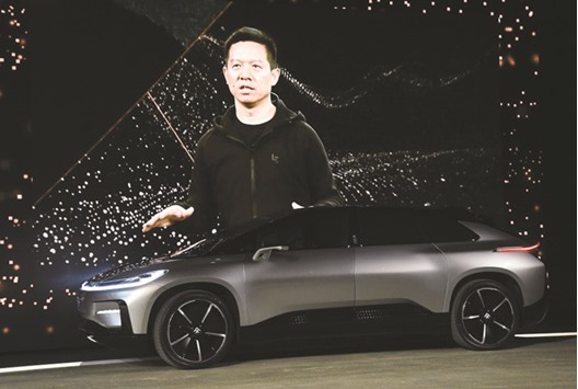 A video image of LeEco Founder and CEO YT Jia is shown as he unveils Faraday Futureu2019s FF 91 prototype electric crossover vehicle during a press event for CES 2017 at The Pavilions at Las Vegas Market on Tuesday. The startup electric-car maker is counting on its debut offering to drum up support from investors, many of whom had been invited to the presentation.