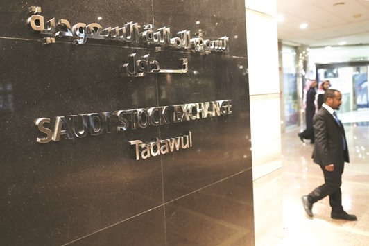 A man walks past the main interior entrance to the Saudi Stock Exchange, also known as the Tadawul, in Riyadh. Riyad REIT, launched by Riyad Capital, which was capitalised at 500mn Saudi riyals and was listed in November-16 in Saudi Arabia, realised an upper circuit limit of a 10% daily return on Day 1 post the listing, and finished the year up by 8.2%.