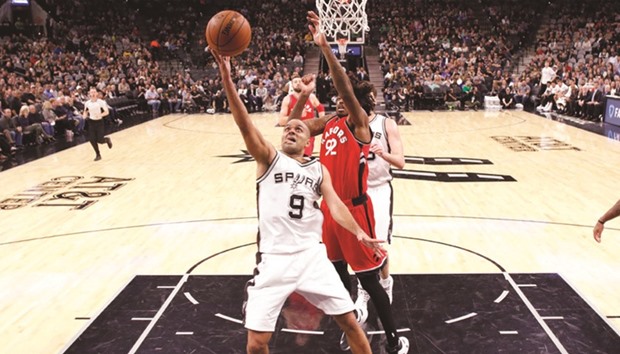 San Antonio Spurs guard Tony Parker (9) goes for the basket during yesterday's NBA game against Toronto Raptors. The Spurs won 110-82. (Soobum Im-USA TODAY Sports)