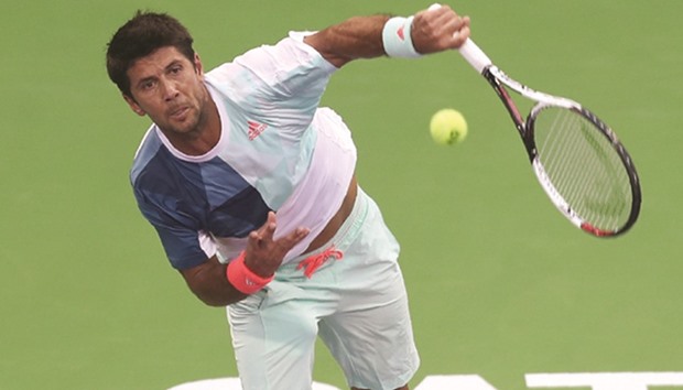 Spainu2019s Fernando Verdasco serves en route to his victory over Belgian fourth seed David Goffin during the second round of the Qatar ExxonMobil Open at the Khalifa International Complex in Doha, yesterday. (AFP)