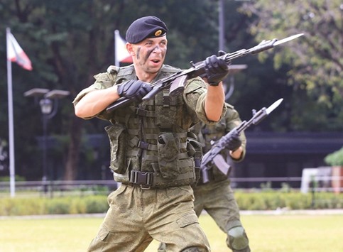 Russian Marines show their individual combat skills during a public capability demonstration at the Luneta National Park in Metro Manila, yesterday.