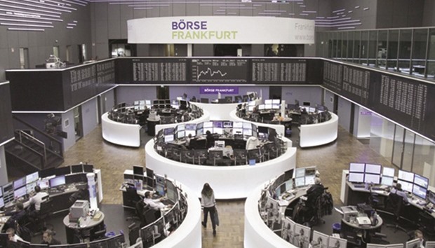 Traders at the Frankfurt Stock Exchange. The DAX 30 gained 0.01% at 11,584.94 yesterday.