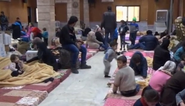 Civilians, who were evacuated from Wadi Barada, sitting inside a shelter in the Damascus suburb of Rawda, Syria