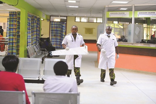 This file photo taken on December 10, 2016 shows Kenyan Defence Force doctors at Nairobiu2019s Kenyatta National Hospital after the last remaining doctors joined a five-day strike.