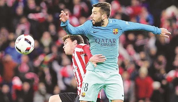 Barcelonau2019s defender Jordi Alba (R) vies with Athletic Bilbaou2019s midfielder Javier Eraso during their Spanish Copa del Rey (Kingu2019s Cup) round of 16 first leg match at the San Mames stadium in Bilbao on Thursday.
