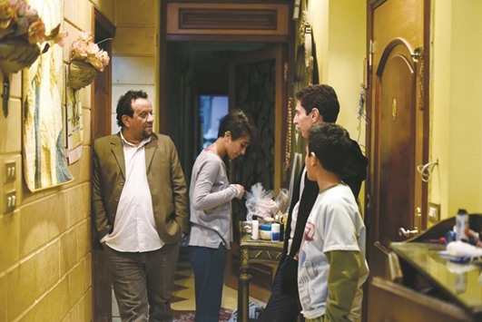 Nagy Luka (left) speaks with his children during an interview in their home in Cairo. Copts, who make up about one tenth of Egyptu2019s population of more than 92mn and who celebrate Christmas today, have long complained of discrimination.