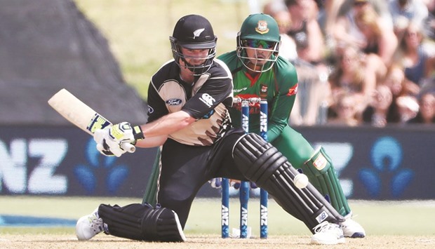 Colin Munro of New Zealand attempts a reverse sweep during the international Twenty20 against Bangladesh at Bay Oval in Mount Maunganui yesterday. (AFP)