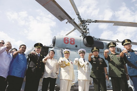 Members of the Russian Navy stand to attention after Philippine President Rodrigo Duterte (not pictured) toured the Russian Navy vessel Admiral Tributs, docked at the south harbour port area in Metro Manila.