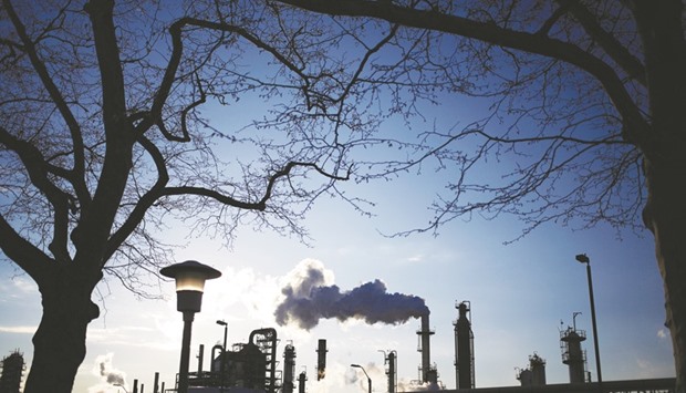 Emissions rise from the Monroe Energy Trainer Refinery in Marcus Hook, Pennsylvania, US. Oil last year capped its biggest annual gain since 2009 as the Organisation of Petroleum Exporting Countries and 11 nations from outside the group agreed on a plan to reduce supply.