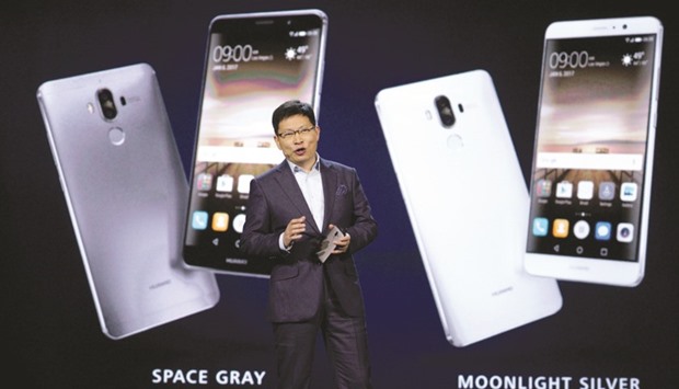 Richard Yu, Huawei CEO at Consumer Business Group, talks about Mate 9 smartphone just released to the US market and displayed behind him during his keynote address at Consumer Electronics Show in Las Vegas.