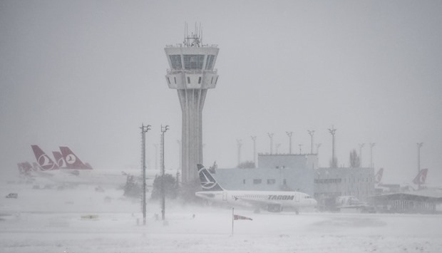 Planes parked at Ataturk international airport during heavy snowfall.