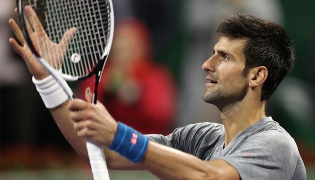 Serbia's Novak Djokovic reacts to winning against Britain's Andy Murray