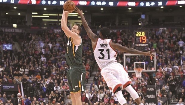 Toronto Raptors guard Terrence Ross (right) reaches out to deflect a shot from Utah Jazz forward Joe Ingles in the fourth quarter of the NBA match at the Air Canada Centre in Toronto, Ontario on Friday. The Raptors won 101-93. (USA TODAY Sports)