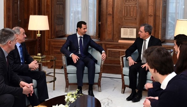 Syrian President Bashar al-Assad (C-L) meeting with French MP Thierry Mariani (C-R)