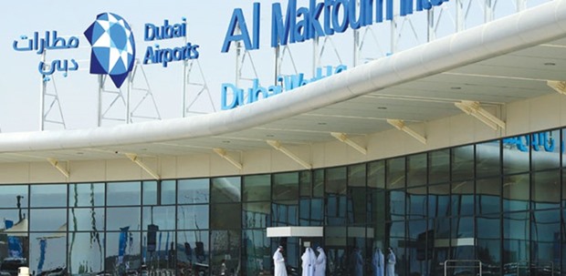 Local staff stand outside the Al Maktoum International Airport in Dubai (file). The $3bn loan for the airport expansion is split between a $2bn conventional tranche and a $1bn-equivalent, local-currency Islamic tranche, according to sources.