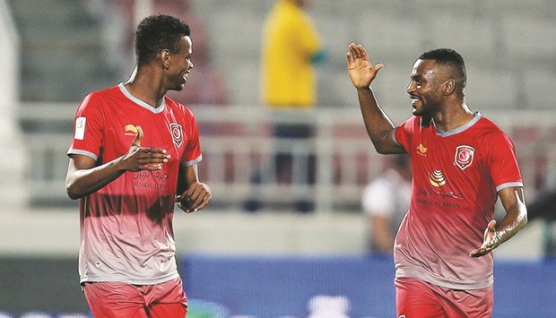 Lekhwiya players Mohammed Muntari (left) and Ismael Mohammed celebrate after the former scored a goal against Al Gharafa yesterday. PICS: Anas Khalid