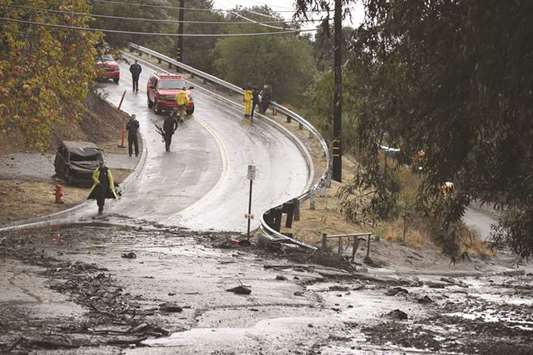 Mud runs over a road in Burbank, California, late on Tuesday.