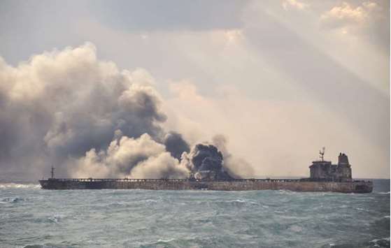 Smoke and flames coming from the burning oil tanker Sanchi at sea off the coast of eastern China.